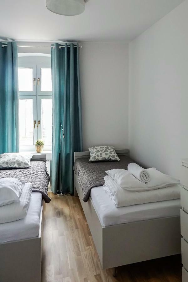 Apartamenty Torunskie Pod Krzywa Wieza Esterno foto